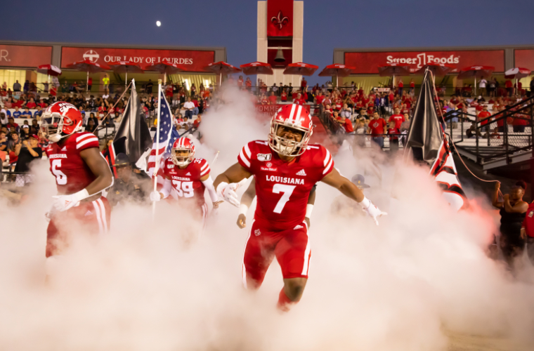 UL Lafayette Ragin Cajun Football team runs onto field through fog