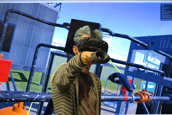 Researcher wearing a VR headset to study virtual reality technology.