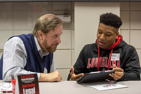 A student presents a business idea during a workshop.