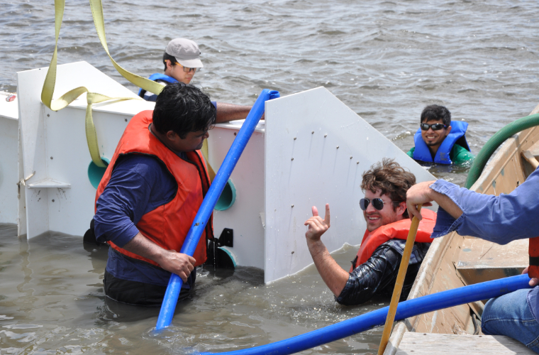 civil engineering faculty and students working on coastal restoration.