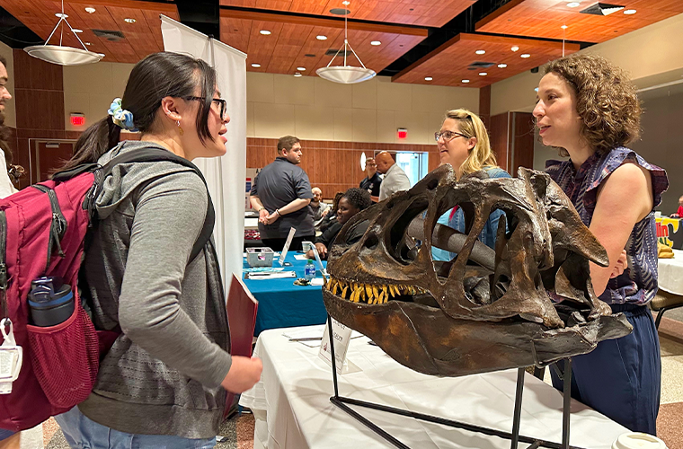 A student interacting with an employer at our Part-Time, Internship, and Summer Job Fair (Spring 2023)