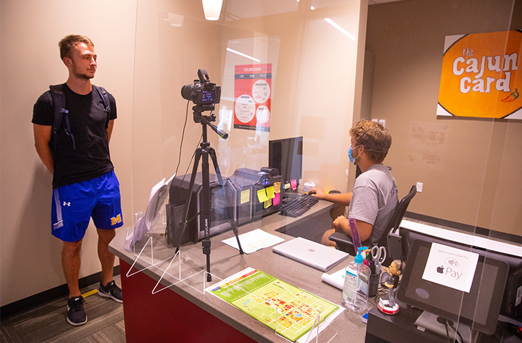UL Lafayette student getting photo taken at Cajun Card Services