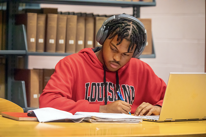 Student on computer in the library