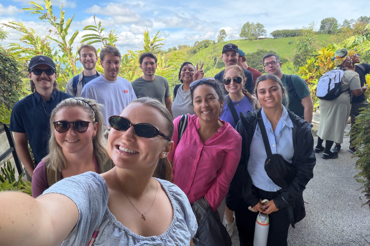 Twelve of the students enrolled in the IBUS 540 study abroad course are pictured outdoors in Costa Rica. 