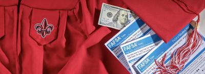 FASFA documents on a UL Lafayette graduation gown