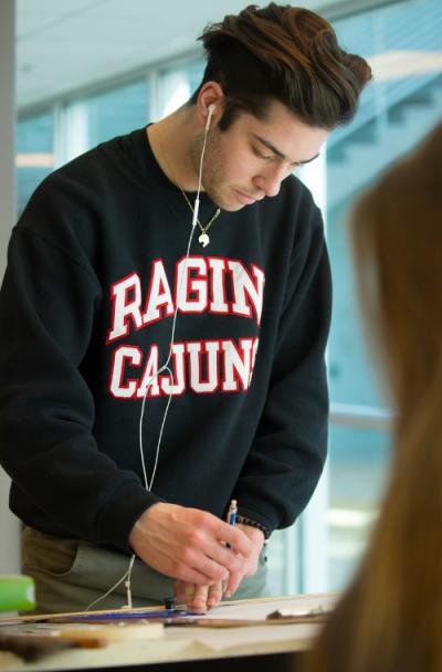 Architecture student Adam Ortego drafting for a class at the University of Louisiana at Lafayette.