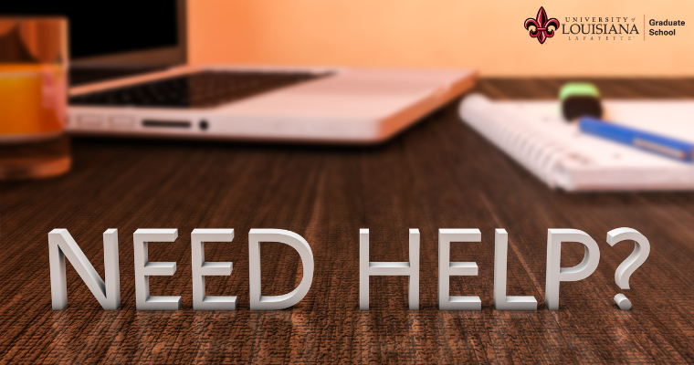 Letters that read Need Help standing on a desk