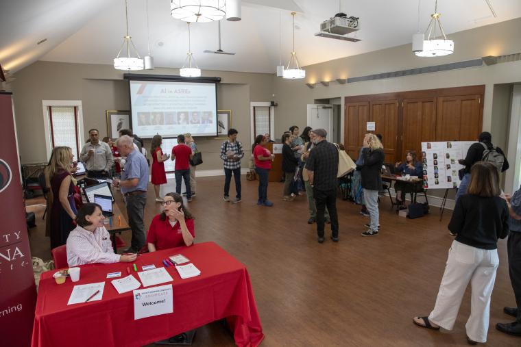 Attendees mill around the UL Lafayette Alumni Association Board Room during the 2026 FLC Showcase.