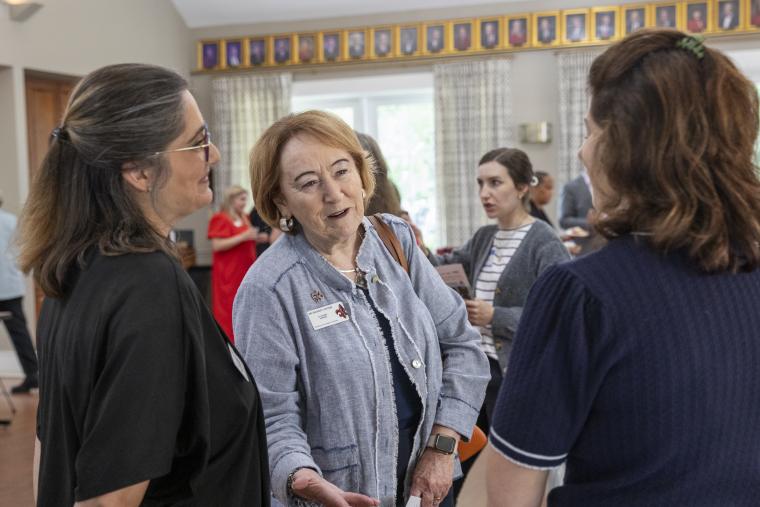 Dr. Dianne Olivier, associate vice president for Academic Affairs, is pictured speaking with presenters during the 2026 FLC Showcase.